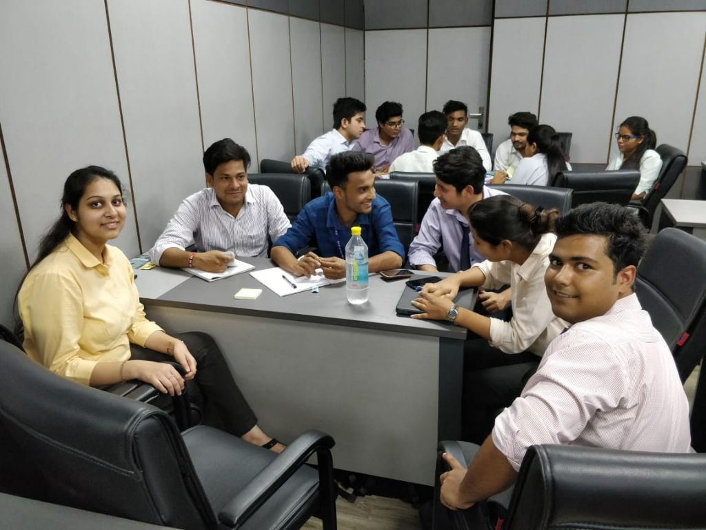 Students collaborating around a shared table, 2018